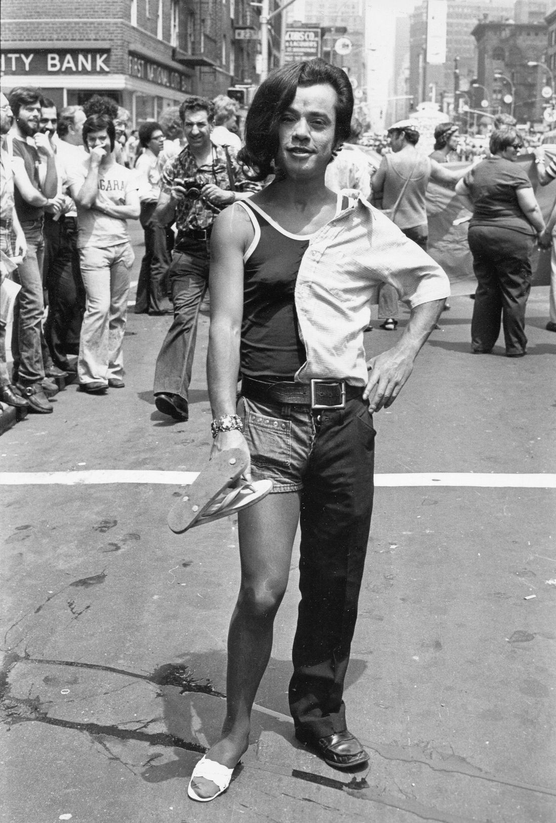 Portrait of a parade-goer at the intersection of West Twenty-Third Street and Sixth Avenue during the Sixth Annual Gay Pride March (Gay Liberation Day), June 29, 1975<br/>